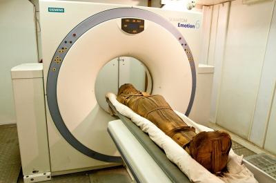 the mummy of Esankh, male, Third Intermediate Period undergoing CT scanning.
