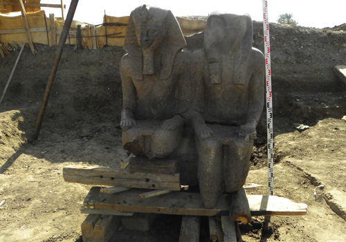 Statue of Amenhotep III and sun god Re-Horakhti discovered a the pharaoh's funerary temple at Luxor