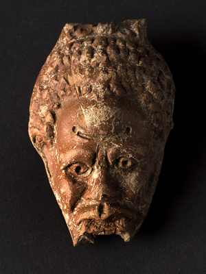 Reservoir of an anthropomorphic oil lamp, with Nubian head. - Image Copyright Herv Paitier INRAP