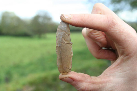 The Neolithic flint blade, found in the interior of the tomb, was likely left with the body of an individual who was buried at the Tirnony Dolmen 5,500 years ago. - Image courtesy the Centre for Archaeological Fieldwork (CAF)