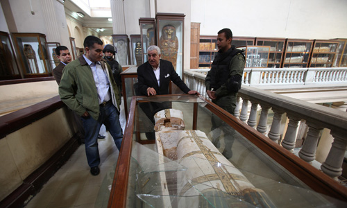 Dr. Zahi standing near the broken vitrine containing the damaged New Kingdom coffin. - Photo by Sandro Vannini