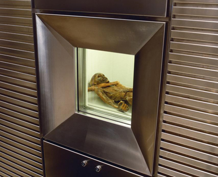 A 40x30 cm wall opening allows visitors to the South Tyrol Museum to take a look into the refrigeration chamber in which the mummy is conserved at a temperature of -6 degrees Celcius and 98 percent air humidity. - Image courtesy the South Tyrol Museum of Archaeology